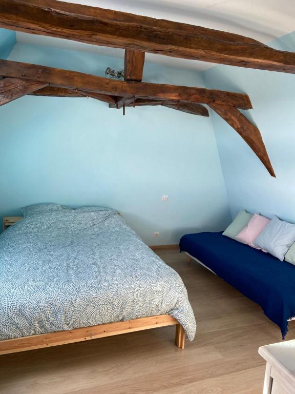 Posteľ alebo postele v izbe v ubytovaní Notre petite maison dans la prairie