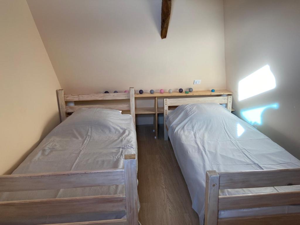 Posteľ alebo postele v izbe v ubytovaní Notre petite maison dans la prairie