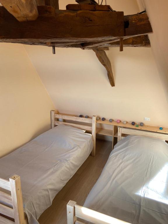 Posteľ alebo postele v izbe v ubytovaní Notre petite maison dans la prairie