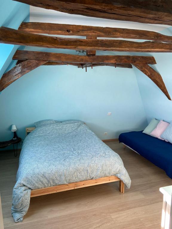 Posteľ alebo postele v izbe v ubytovaní Notre petite maison dans la prairie