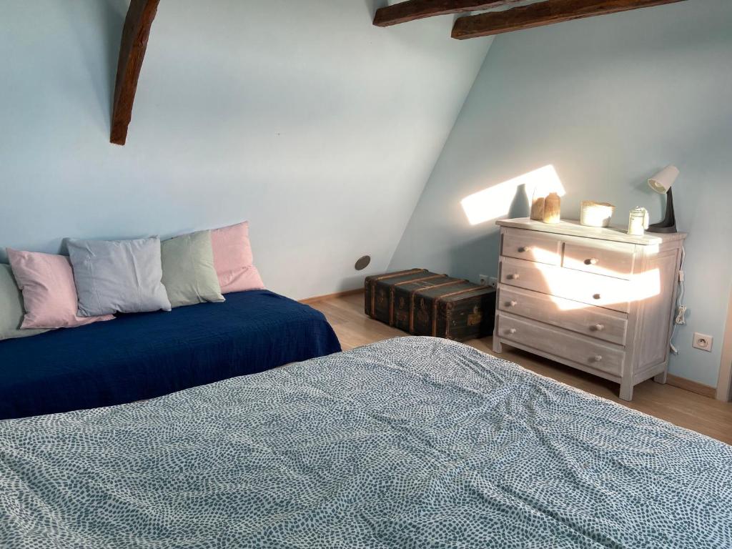 Posteľ alebo postele v izbe v ubytovaní Notre petite maison dans la prairie