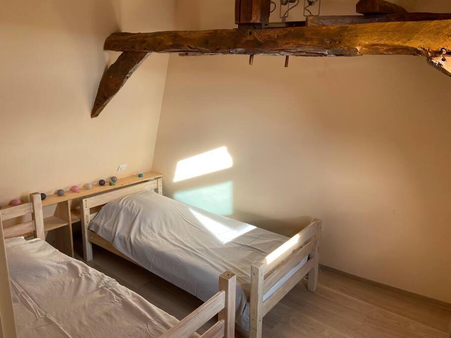 Posteľ alebo postele v izbe v ubytovaní Notre petite maison dans la prairie