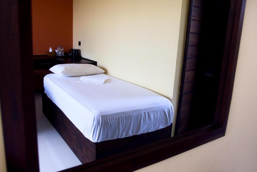 Postel nebo postele na pokoji v ubytování Royal Rock Sigiriya