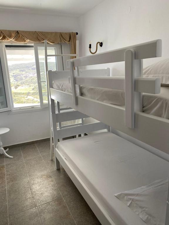 Postel nebo postele na pokoji v ubytování XALAKAS SUMMER HOUSE