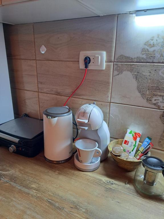 a kitchen counter with a coffee maker and a blender at Etno house HAPPY VILLAGE in Cetinje