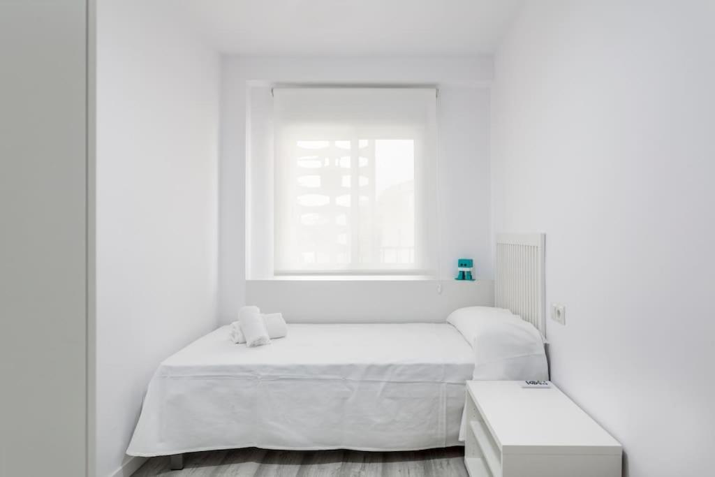 Postel nebo postele na pokoji v ubytování Fantástico apartamento junto al mar