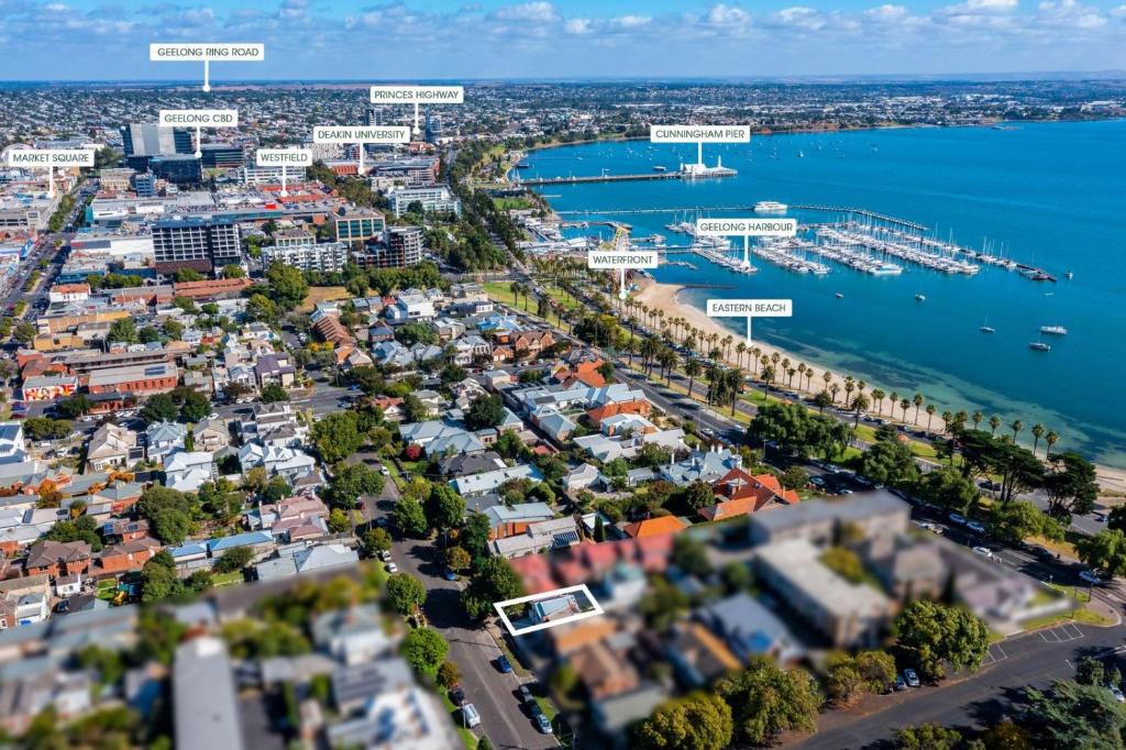an aerial view of a city with a harbor at Eastern Beach Retreat in Geelong