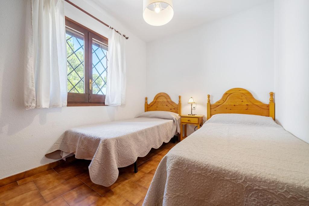 Posteľ alebo postele v izbe v ubytovaní Hauzify I Casa l'Estany