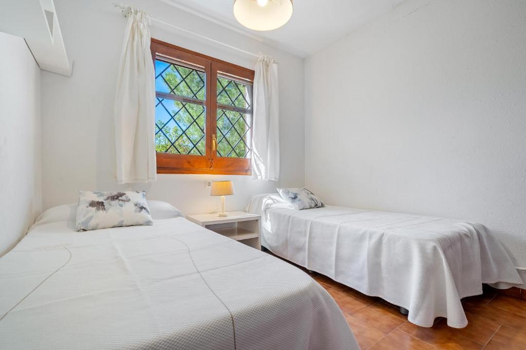Posteľ alebo postele v izbe v ubytovaní Hauzify I Casa l'Estany