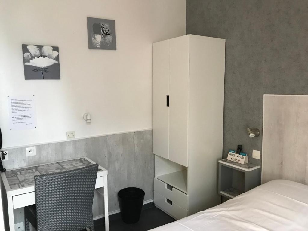 Postel nebo postele na pokoji v ubytování Logis - Le Neptune Hôtel & Restaurant