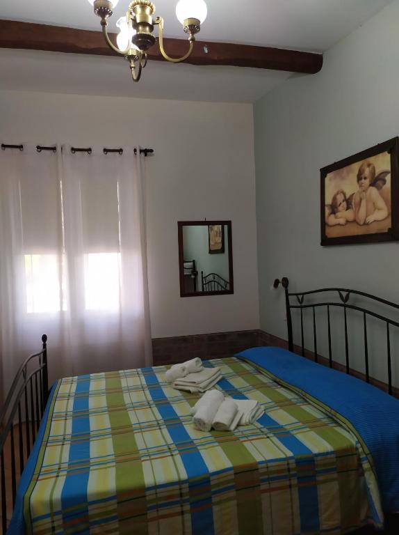 Postel nebo postele na pokoji v ubytování Il Vigneto "Cottage"