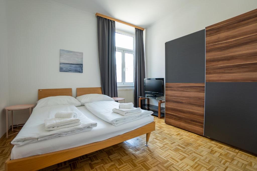 A bed or beds in a room at Two bedrooms family nice apartment