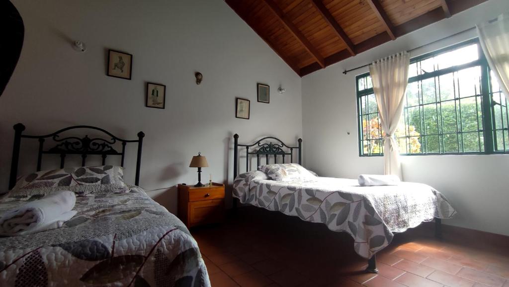 Letto o letti in una camera di New Paradise Casa Campestre