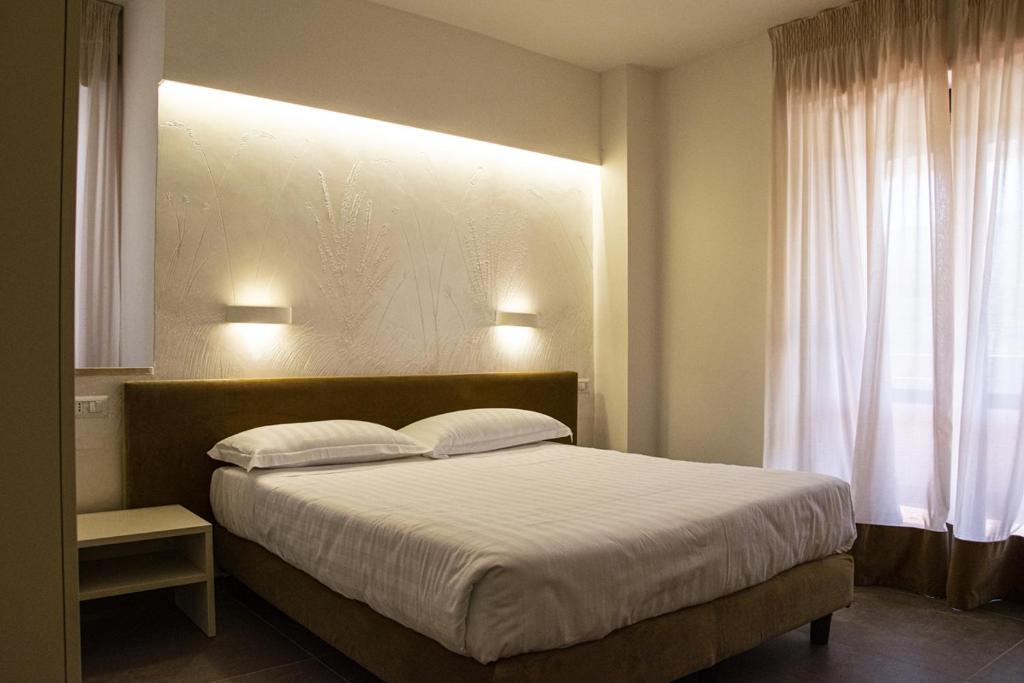 Postel nebo postele na pokoji v ubytování Hotel Terme Sant'Egidio