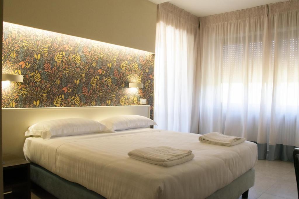 Postel nebo postele na pokoji v ubytování Hotel Terme Sant'Egidio
