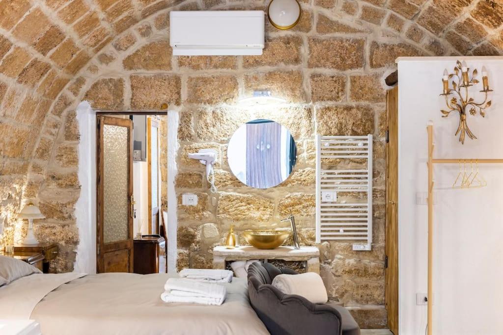 Postel nebo postele na pokoji v ubytování Corte Lirice Paradiso