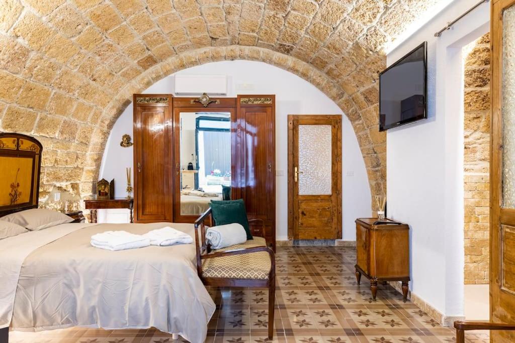 Postel nebo postele na pokoji v ubytování Corte Lirice Paradiso