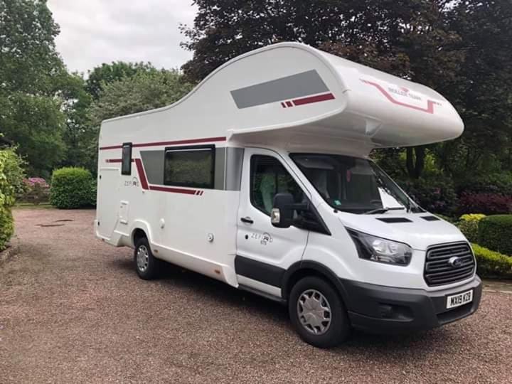 a white camper truck parked in a parking lot at FORD ZEFIRO 675 MOTORHOME in Wigan