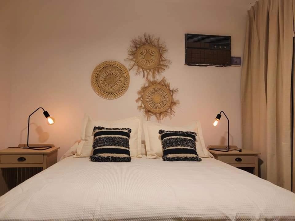 Postel nebo postele na pokoji v ubytování Casa Roque Funes, ubicado en Cerro de las Rosas Córdoba, Ofrece, Asador, Pileta, Cercanias, Estadio Kempes, aeropuerto Ambrosio Taravella, Orfeo Superdomo, Sanatorio Allende, Casa con 2 departamentos individuales y áreas comunes