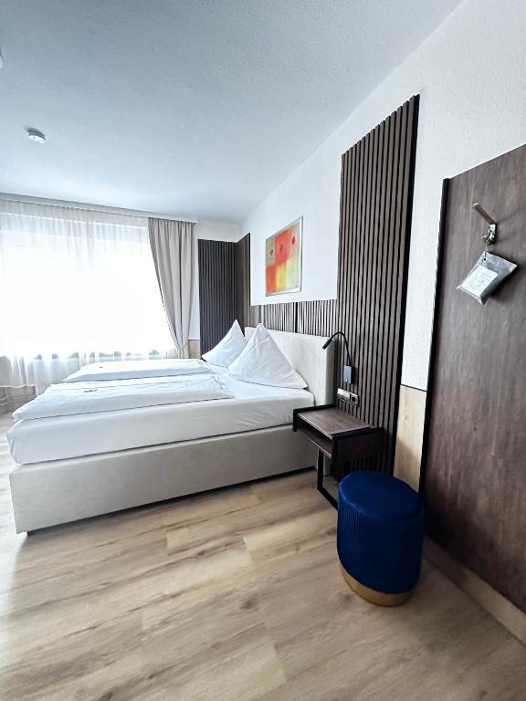 Postel nebo postele na pokoji v ubytování Hotel Bilger Eck