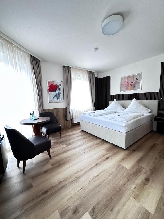 Postel nebo postele na pokoji v ubytování Hotel Bilger Eck