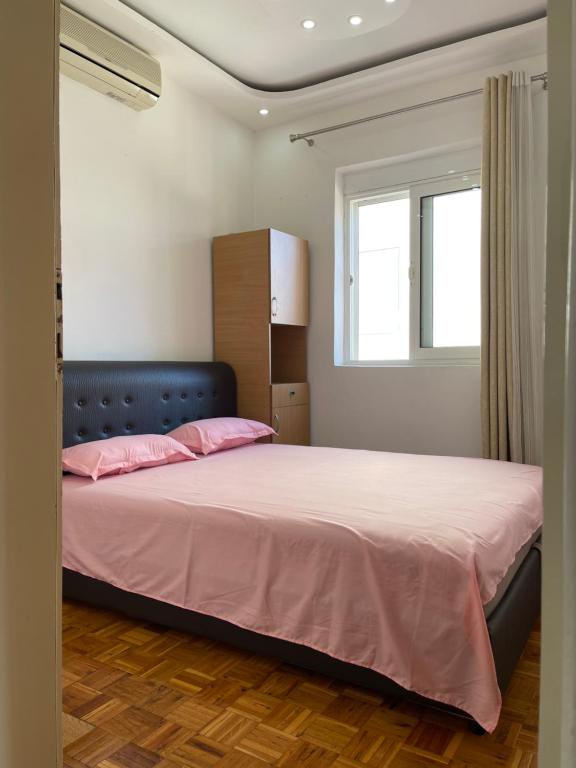 Postel nebo postele na pokoji v ubytování Apartmani centar ulcinj