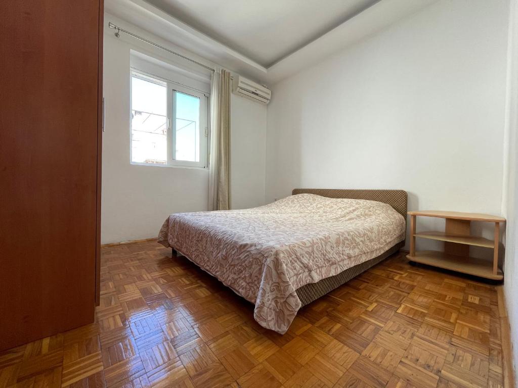 Postel nebo postele na pokoji v ubytování Apartmani centar ulcinj