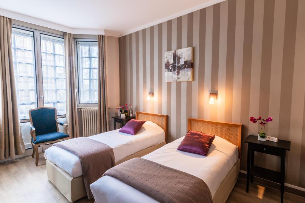 Postel nebo postele na pokoji v ubytování Grand Hôtel de L'Espérance