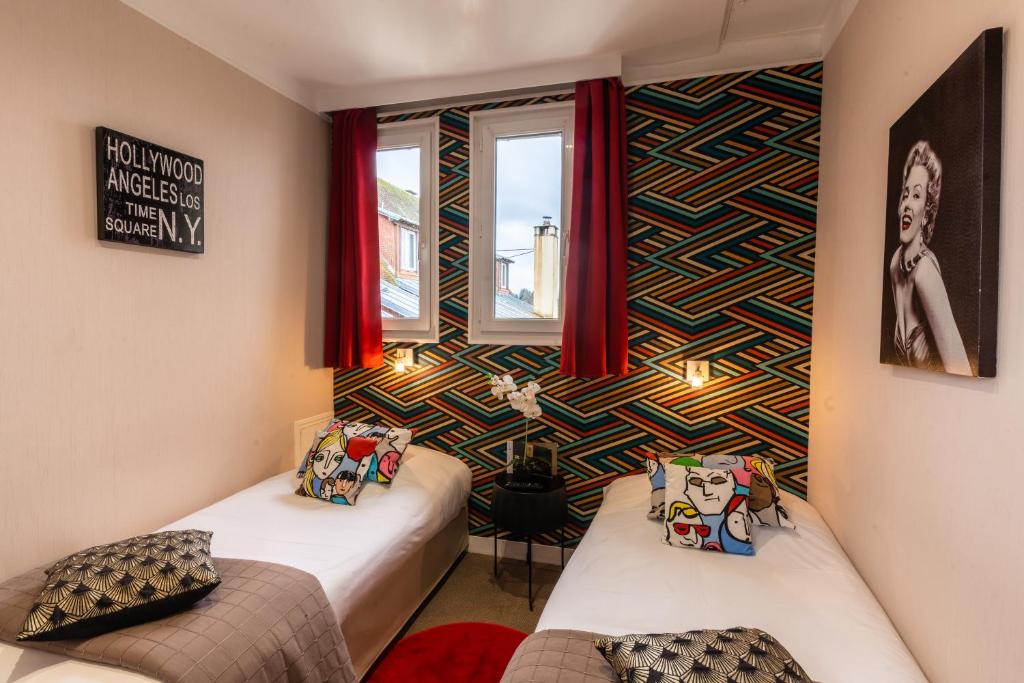 Postel nebo postele na pokoji v ubytování Grand Hôtel de L'Espérance