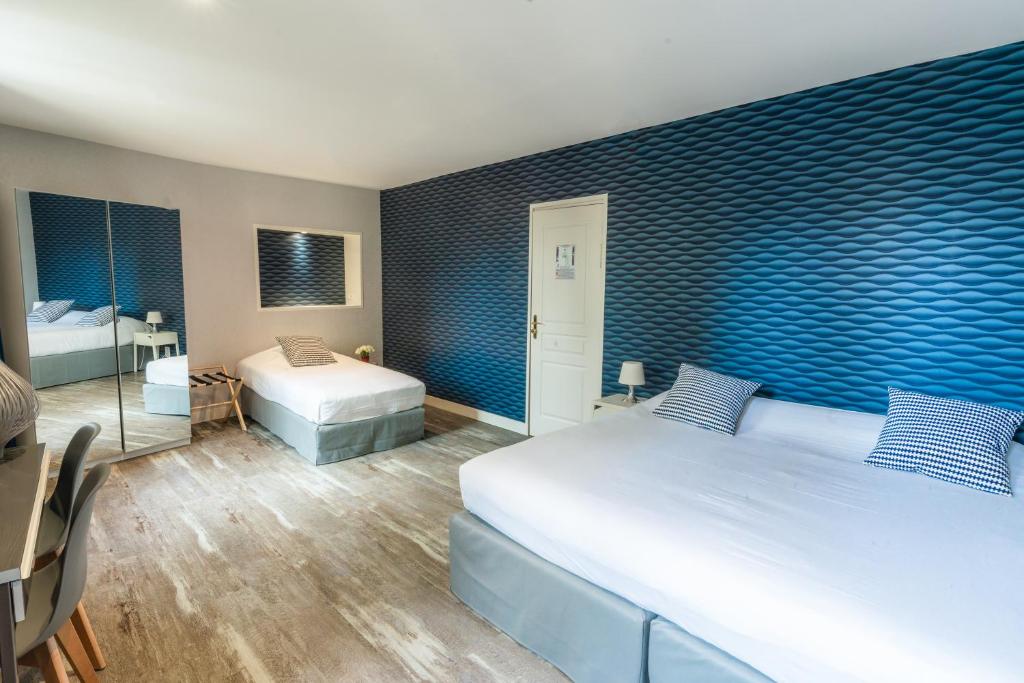Postel nebo postele na pokoji v ubytování Grand Hôtel de L'Espérance