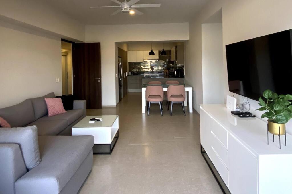 a living room with a couch and a table at apartamento (de) Linda in Puerto Vallarta