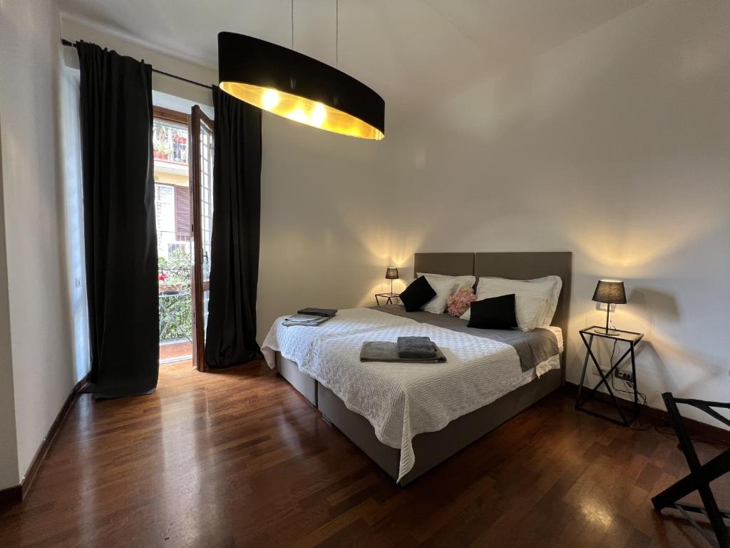 A bed or beds in a room at EMI's Guest House