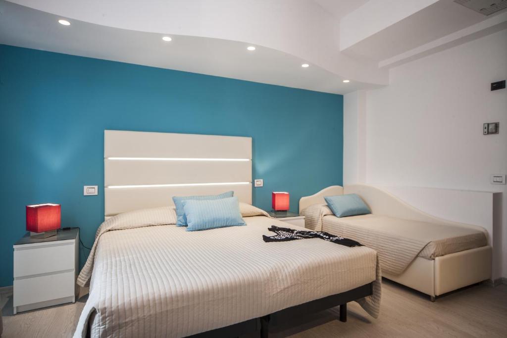 Postel nebo postele na pokoji v ubytování Hotel Levante