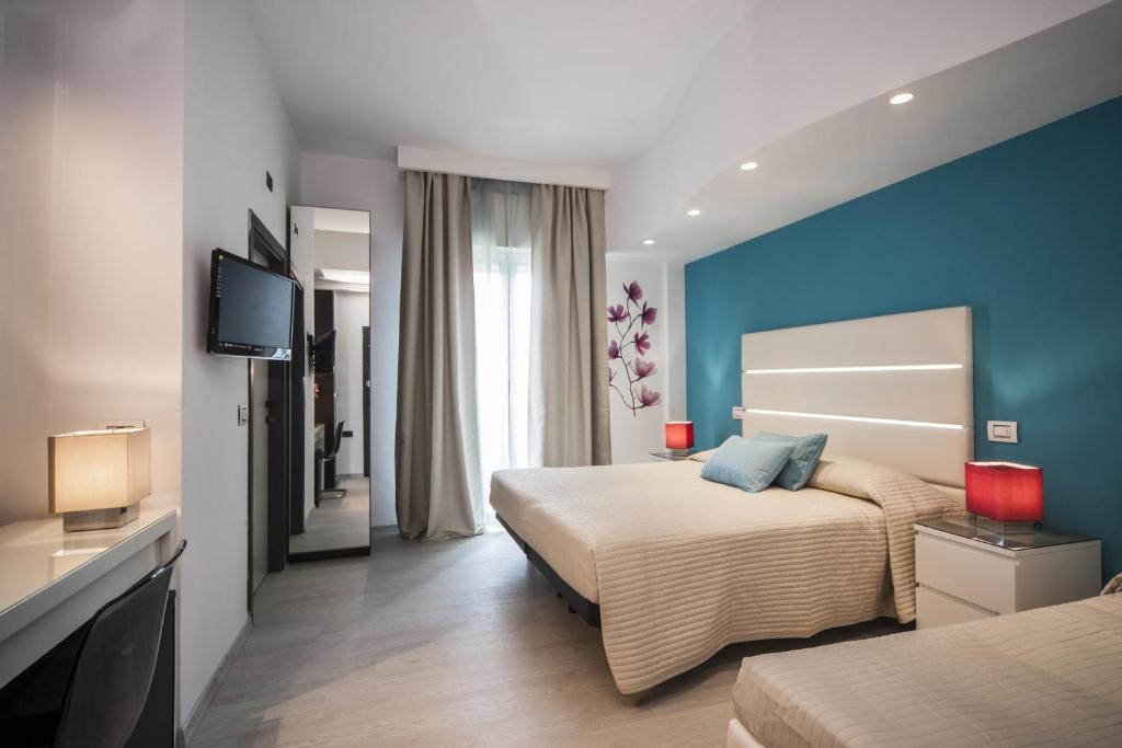 Postel nebo postele na pokoji v ubytování Hotel Levante