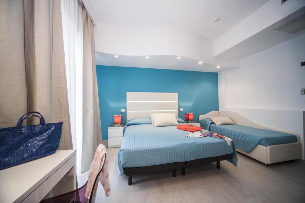 Postel nebo postele na pokoji v ubytování Hotel Levante