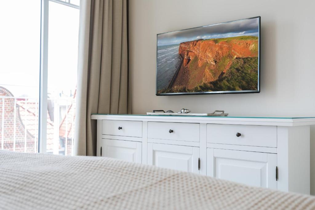 TV a/nebo společenská místnost v ubytování Strandvilla Apartment Meeresglück