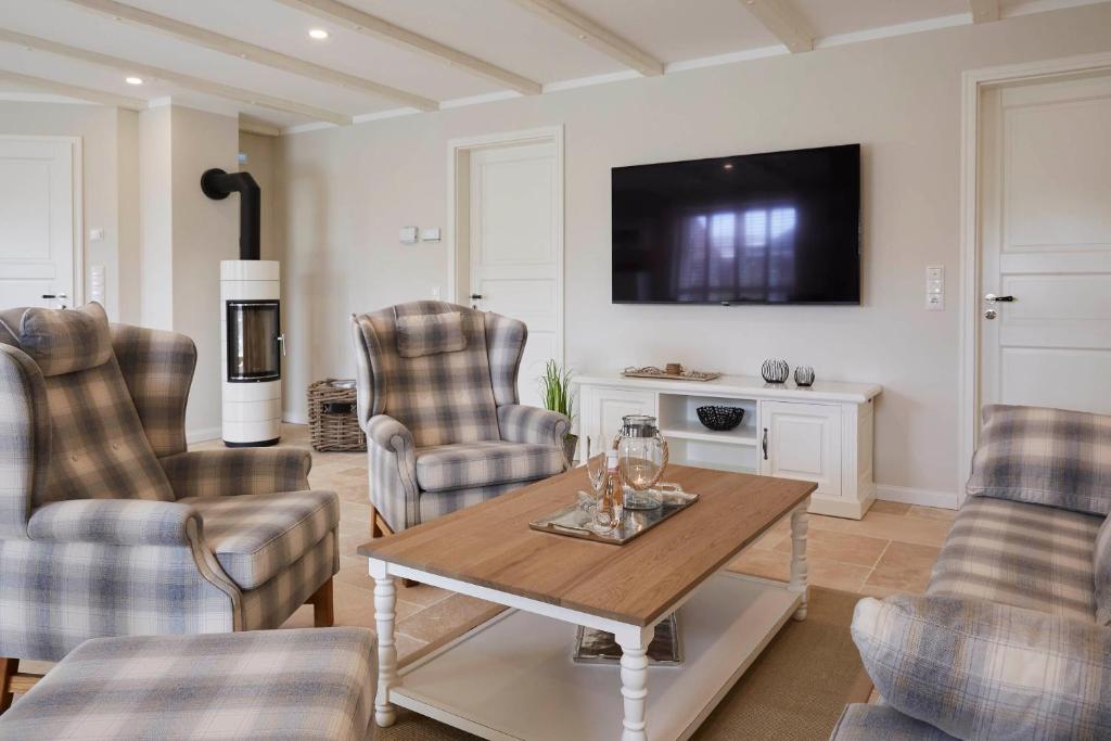 TV a/nebo společenská místnost v ubytování Reethus "de Tweeling" Apartment EG