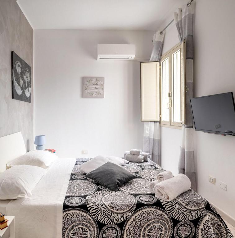 Postel nebo postele na pokoji v ubytování A casa tua Affitti brevi