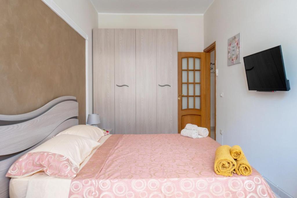 Postel nebo postele na pokoji v ubytování A casa tua Affitti brevi