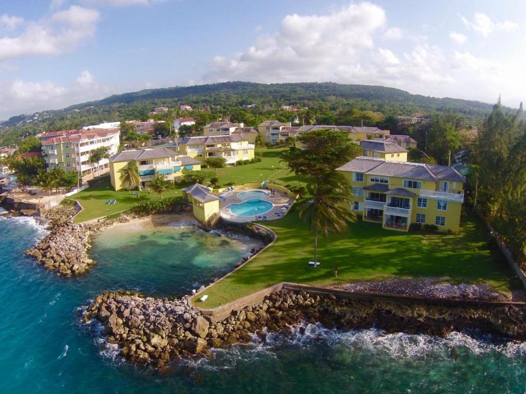 an aerial view of a resort on the ocean at Sea Palms Beach Holiday in St Mary