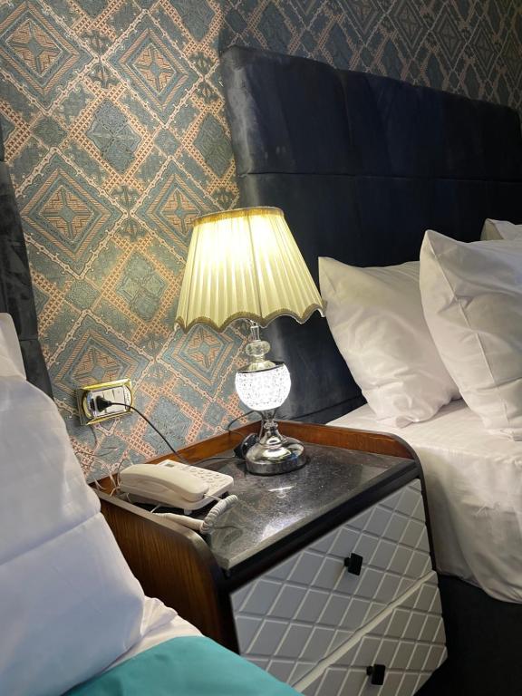 Postel nebo postele na pokoji v ubytování Cairo Inn