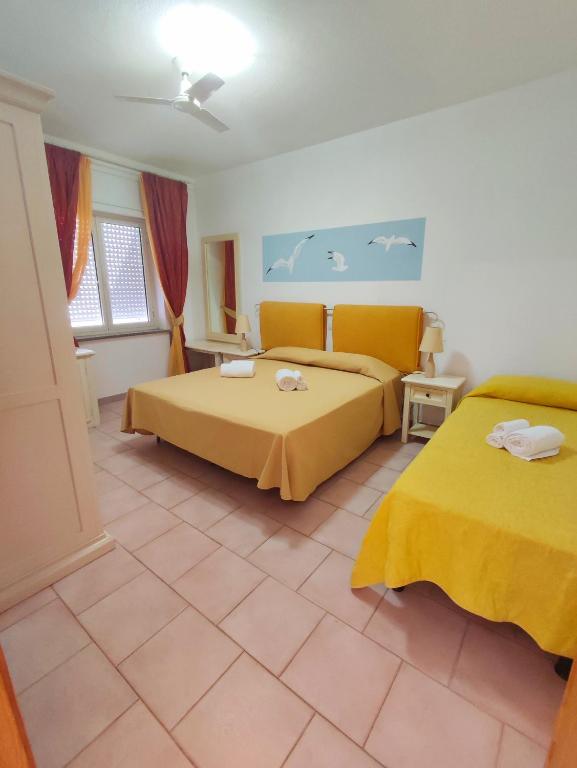 Postel nebo postele na pokoji v ubytování A.I.R. Hotel Gabbiano