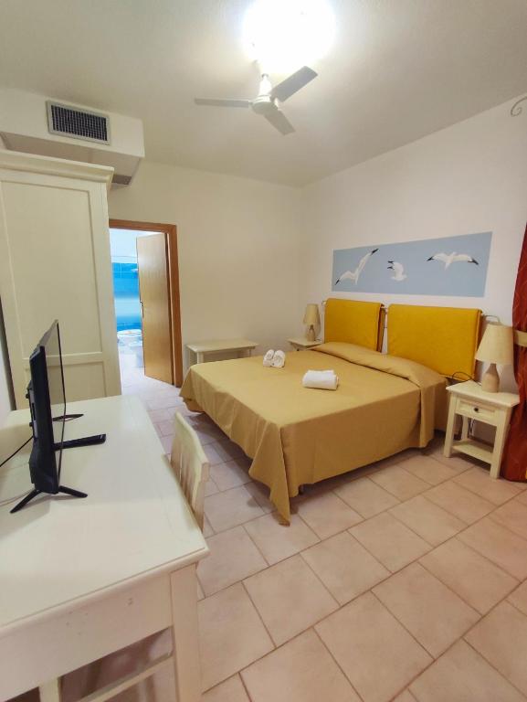 Postel nebo postele na pokoji v ubytování A.I.R. Hotel Gabbiano