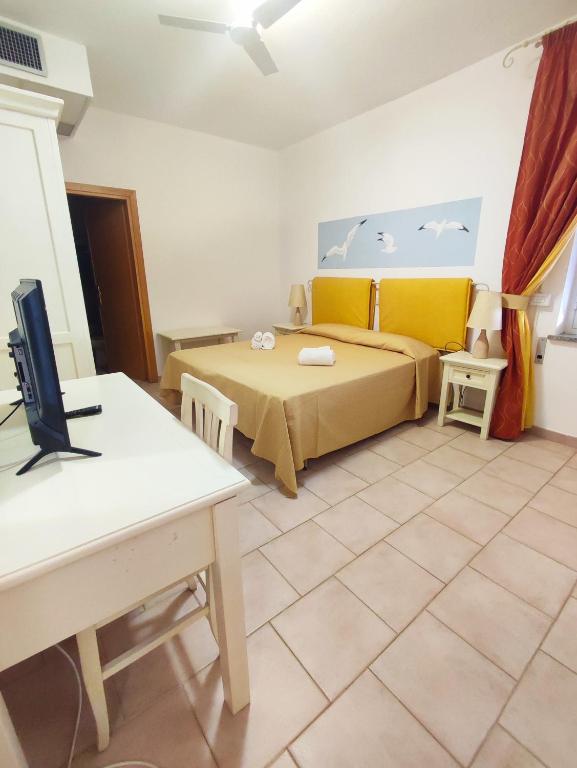 Postel nebo postele na pokoji v ubytování A.I.R. Hotel Gabbiano
