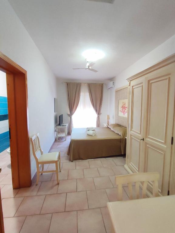Postel nebo postele na pokoji v ubytování A.I.R. Hotel Gabbiano