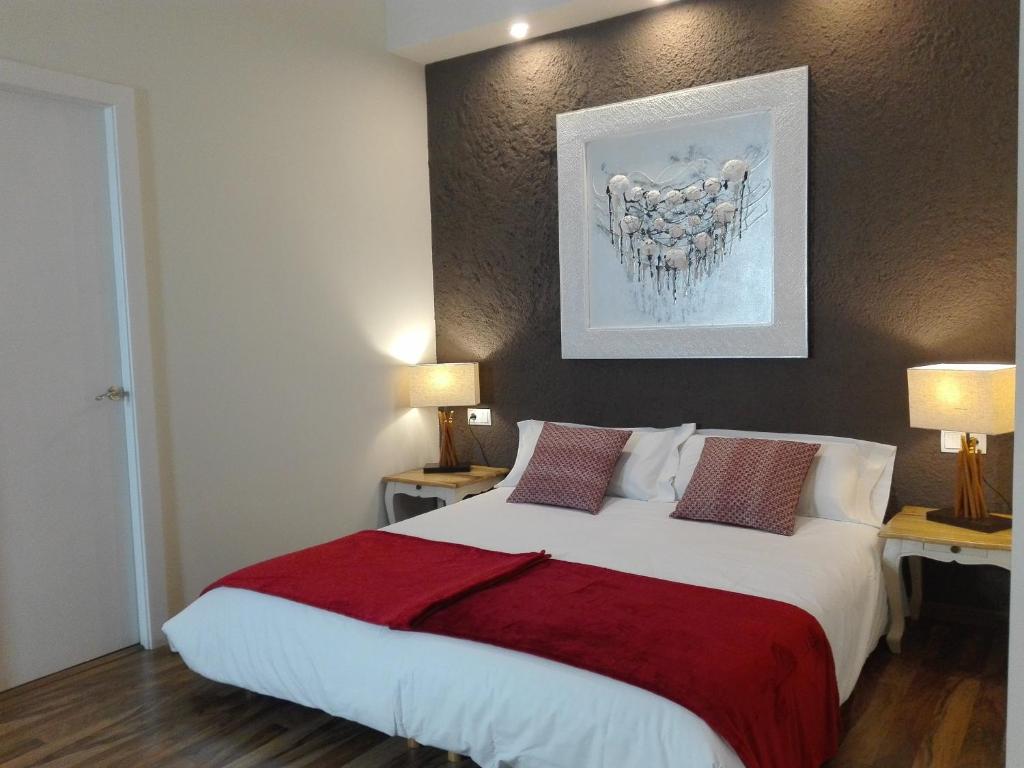 Postel nebo postele na pokoji v ubytování Cal Music B&B