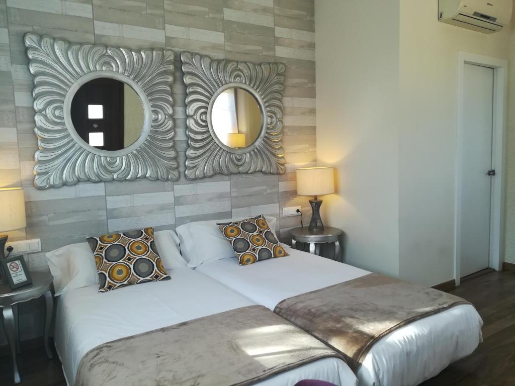 Postel nebo postele na pokoji v ubytování Cal Music B&B