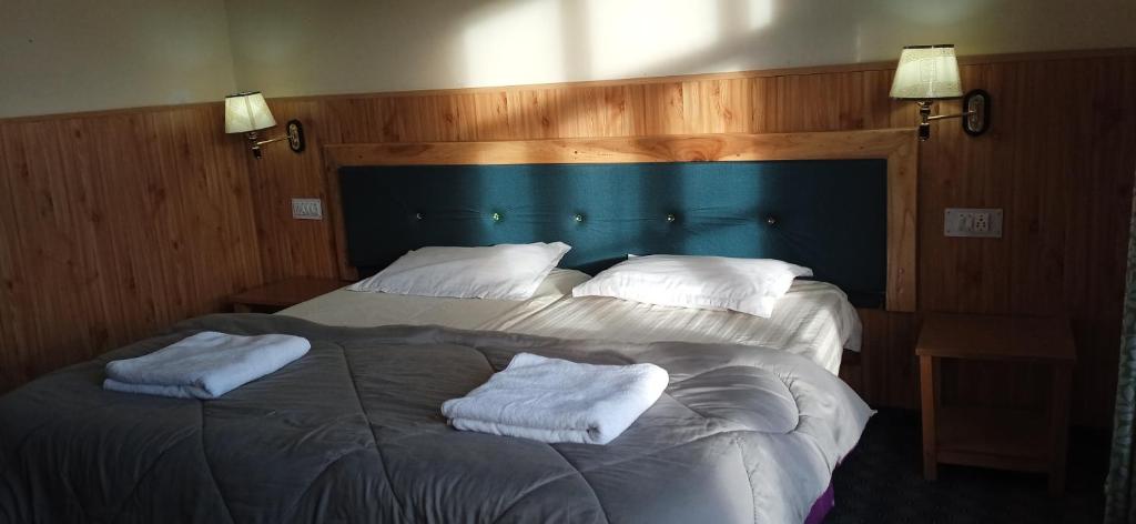 Postel nebo postele na pokoji v ubytování Chandan Guest House