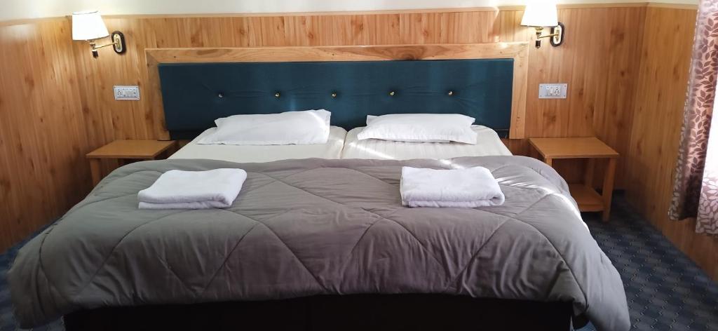 Postel nebo postele na pokoji v ubytování Chandan Guest House