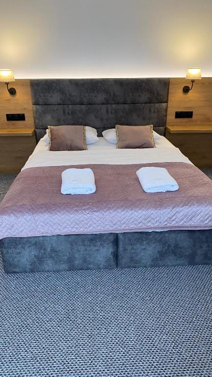 Posteľ alebo postele v izbe v ubytovaní Nasze Kamienice Apartament Rodzinny